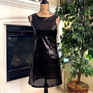 Wet Seal Black Sequined Mini Dress L  is a Junior size dress. It fit a SM adult
